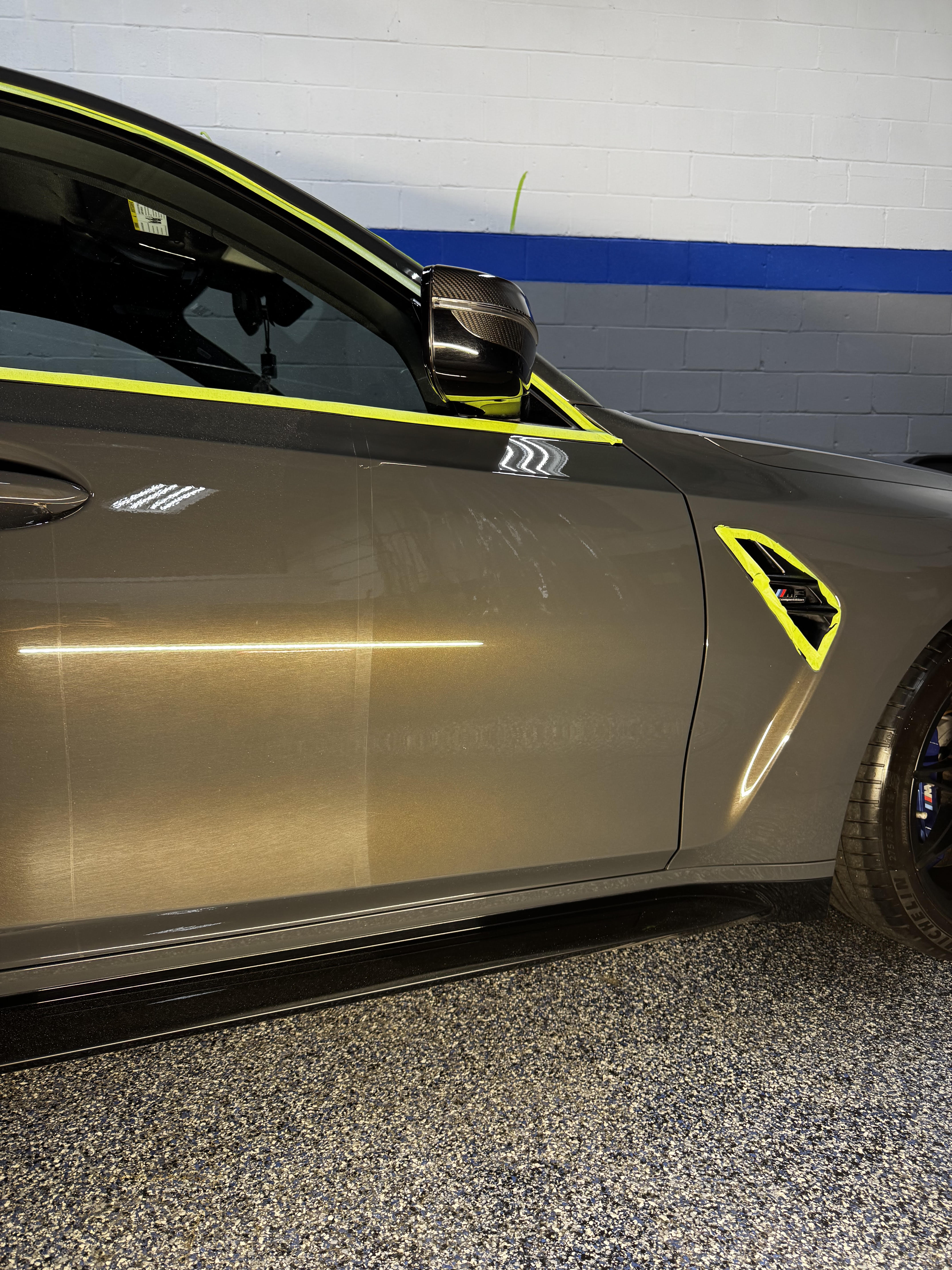 Gray BMW rear quarter and wheel
